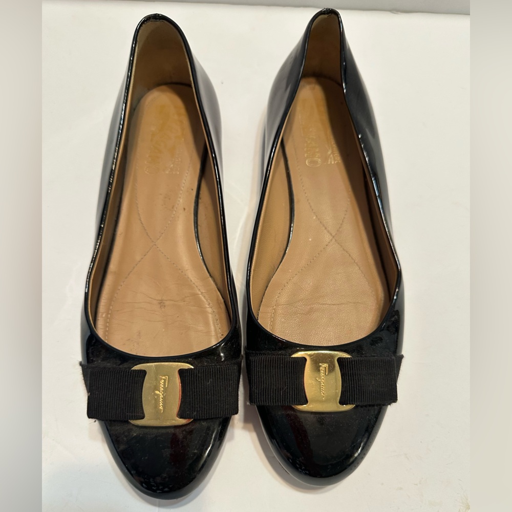 Salvatore Ferragamo Black and Gold Loafers with Glossy Finish
